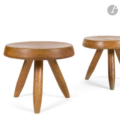 two small wooden stools with wooden legs on a white background