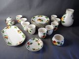 a lot of dishes and cups that are on the table