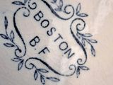 a close up of a plate with the words boston on it