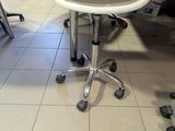 a chair that is sitting on the floor next to a table