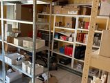 a room that has a lot of shelves and boxes on it