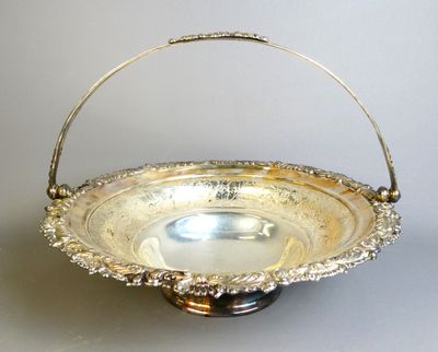 a silver plate with a handle on a table