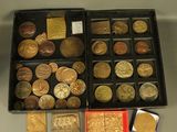 a lot of coins in a black box on a table