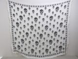 a black and white skull print scarf hanging on a wall