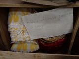 a note that is in a wooden box with a pair of scissors