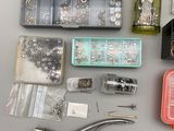 many different types of jewelry and tools on the table