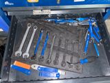 a tool drawer with a bunch of tools inside of it