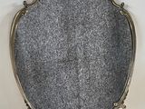 a close up of a mirror sitting on top of a table