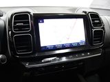 the dashboard of a car with a gps device in the center of it