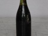 a bottle of wine that is sitting on a table