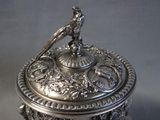 a silver box with a bird on top of it