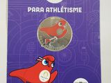 a close up of a book with a red bird on it