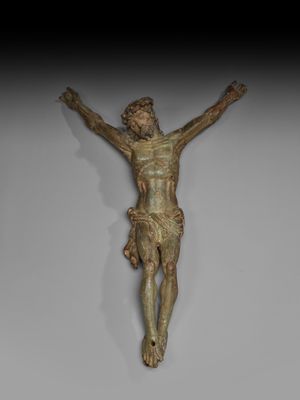 une image représentant une statue de Jésus sur une croix, accrochée au mur