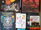 many books that are in a box on the table