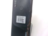 the back of a black phone with a barcode on it