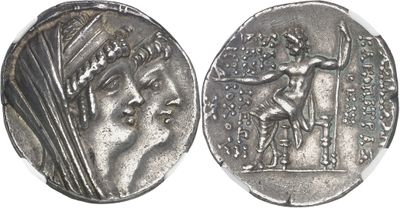 a close up of a silver coin with a man on it