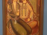 a painting of two women sitting next to each other in front of a blue wall