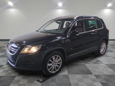 a picture of a black volkswagen suv on a checkered floor