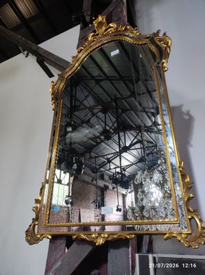 a mirror hanging on the wall in a room