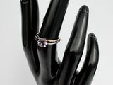 a black hand with a ring on top of it