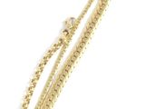 two gold chains with a clasp on a white background