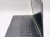 a laptop that is open on a white surface