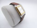 an image of a wrist watch with a brown leather band
