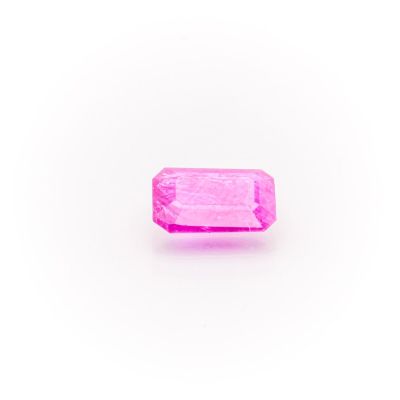 a pink sapphire stone on a white background