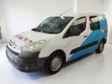 the small van is parked in a white room with a blue stripe on the side