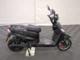 a scooter that is parked on a checkered floor