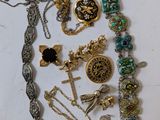 a lot of jewelry that is laying out on the table