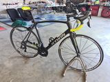 a bike that is sitting on a stand in a garage