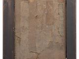 an old picture frame with a piece of paper in it