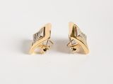 a pair of gold and diamond earrings on a white background