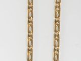 gold plated necklace and earrings on a white background