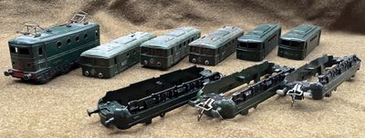 a lot of toy trains that are sitting on the ground