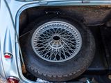 a car that has a tire in the back of it