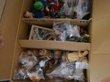 a lot of toys in a box on the floor