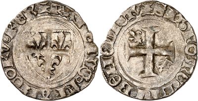 a silver coin with an image of a cross on it