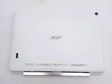 the back of a white laptop computer sitting on top of a white table