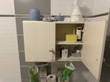 a small cabinet with a lot of items in it