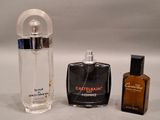 a bottle of perfume and a bottle of cologne on a table