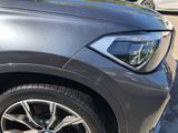 a close up of a bmw suv parked in a parking lot