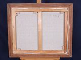 an old wooden easel with two canvass on top of it