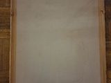 an empty piece of paper hanging on the wall in a room