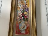 a painting of flowers in a vase on a wall