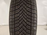 a close up of a tire on a white surface