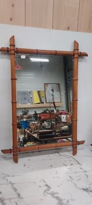 a mirror that is on the wall in a room