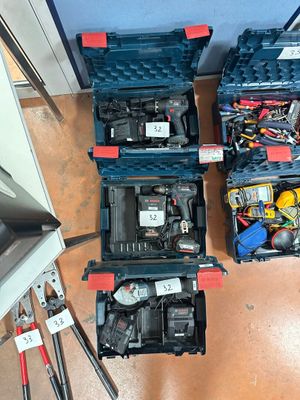 many tools in the case on the floor next to each other