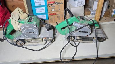 two power tools sitting on a table in a room